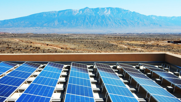 Solar panels and view of the Sandia Mountains